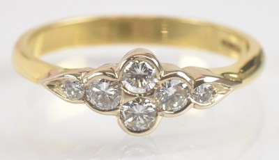 Lot 1249 - An 18ct yellow gold diamond ring, set with six...