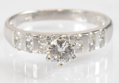 Lot 1336 - A 14ct white gold diamond ring, the six claw...