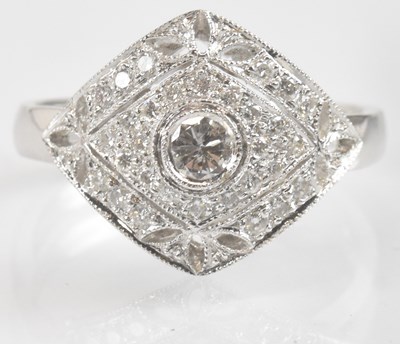 Lot 1251 - An 18ct white gold diamond set ring, with...
