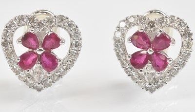 Lot 1400 - A pair of 18ct white gold diamond and ruby...