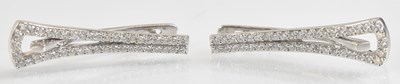 Lot 1391 - A pair of 18ct white gold diamond earrings,...