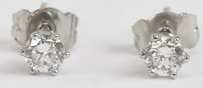 Lot 1398 - A pair of 18ct white gold diamond single stone...