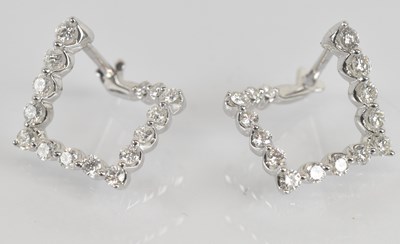 Lot 1397 - A pair of 18ct white gold diamond set earrings...