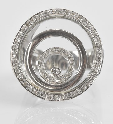 Lot 1237 - IN THE STYLE OF CHOPARD; an 18ct white gold...