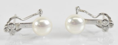 Lot 1406 - A pair of 18ct white gold diamond and cultured...