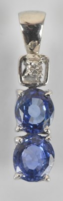 Lot 1472 - A 9ct white gold tanzanite and diamond three...