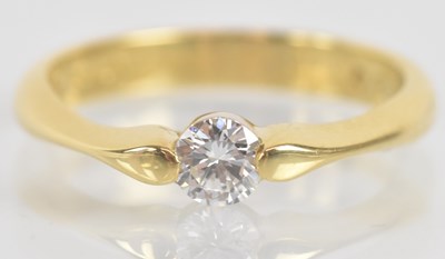 Lot 1241 - An 18ct yellow gold diamond solitaire ring,...