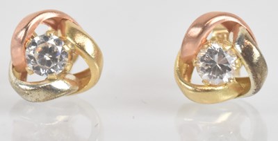 Lot 1258 - A pair of 9ct three colour gold ear studs,...