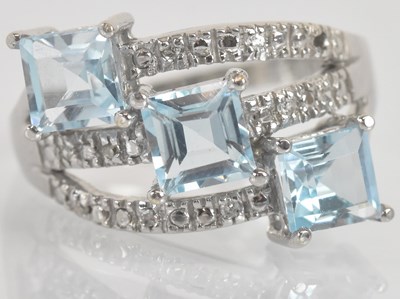 Lot 1331 - A 9ct white gold blue topaz and diamond set...