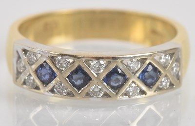 Lot 1266 - An 18ct yellow gold sapphire and diamond ring,...