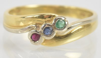 Lot 1283 - An 18ct yellow gold ruby, sapphire and emerald...