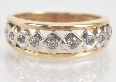 Lot 1308 - A 9ct yellow gold diamond half eternity ring,...