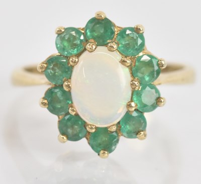 Lot 1317 - A 9ct yellow gold opal and emerald floral...