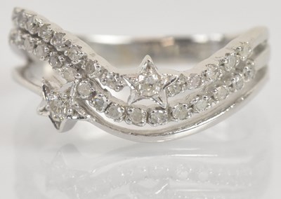 Lot 1334 - A 14ct white gold diamond set ring of unusual...