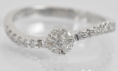 Lot 1276 - An 18ct white gold diamond set ring of...