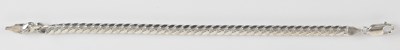 Lot 1348 - A 9ct white gold curb link bracelet, length...
