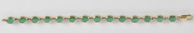 Lot 1347 - A 9ct yellow gold and green agate set line...