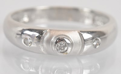Lot 1286 - An 18ct white gold and three stone diamond...