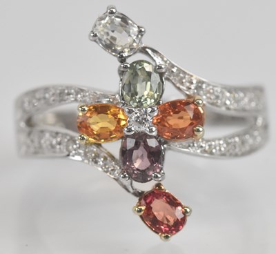 Lot 1291 - An 18ct white gold diamond and coloured...