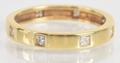 Lot 1268 - An 18ct yellow gold and diamond set ring, with...