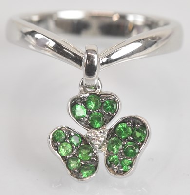 Lot 1289 - An unusual 18ct white gold green garnet and...