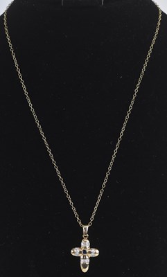 Lot 1465 - A 9ct yellow gold sapphire and diamond cross...