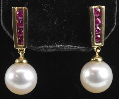 Lot 1414 - A pair of 9ct yellow gold ruby and cultured...