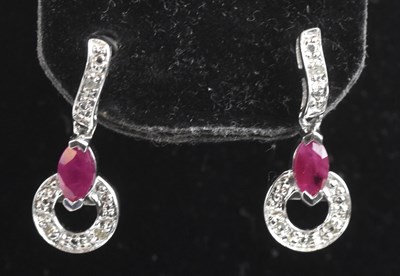 Lot 1415 - A pair of 9ct white gold ruby and diamond drop...