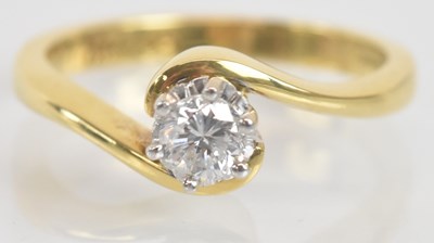 Lot 1264 - An 18ct yellow gold diamond solitaire ring,...