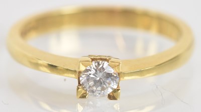 Lot 1280 - An 18ct yellow gold diamond solitaire ring,...