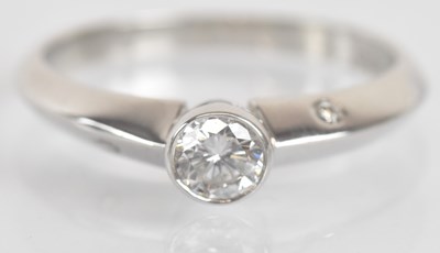 Lot 1253 - An 18ct white gold and diamond set solitaire...