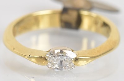 Lot 1255 - An 18ct yellow gold diamond solitaire ring,...