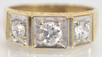 Lot 1307 - A 9ct yellow gold dress ring set with three...