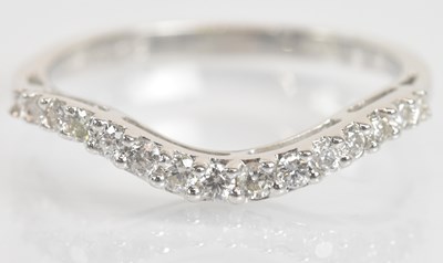 Lot 1293 - An 18ct white gold diamond set wishbone ring,...