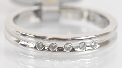 Lot 1324 - A 9ct white gold diamond set ring, the five...
