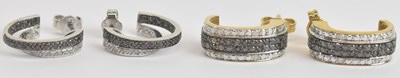 Lot 1405 - A pair of 9ct yellow gold diamond and black...