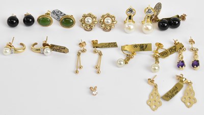 Lot 1389 - Nine pairs of 9ct yellow gold mounted earrings...