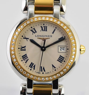 Lot 35 - LONGINES; a lady's bimetallic Prima Luna...