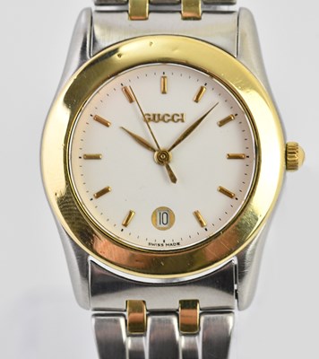 Lot 8 - GUCCI; a lady's bimetallic stainless steel...