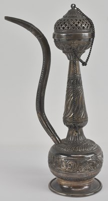 Lot 1183 - An Indian white metal coffee pot, with floral...