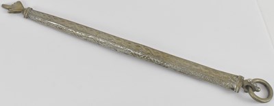 Lot 1060 - An Eastern white metal Torah guide, with loop...