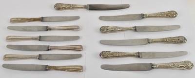 Lot 1186 - Two sets of six white metal handled knives,...