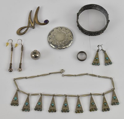 Lot 1149 - A 925 hallmarked silver 'M' brooch, set with...