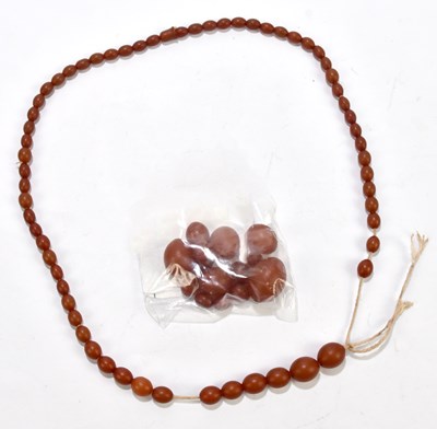 Lot 1355 - A cherry amber style bead necklace, in need of...