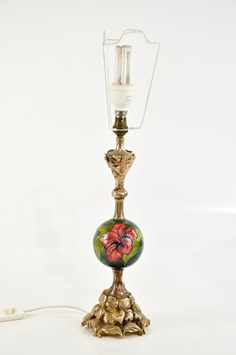 Lot 1436 - WALTER MOORCROFT; a table lamp with globular...