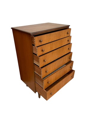 Lot 16 - A mid century teak pillar chest of six drawers,...