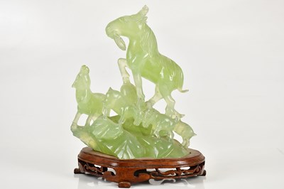 Lot 571 - A Chinese hardstone figure group, representing...