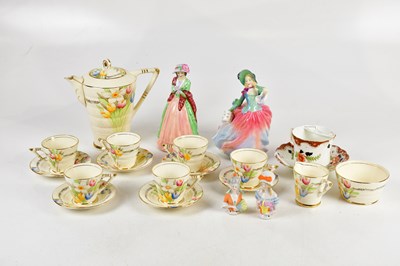 Lot 1528 - PHOENIX WARE; a floral decorated part tea...