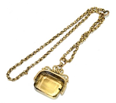 Lot 1387 - A citrine swivel pendant on a 9ct yellow gold...