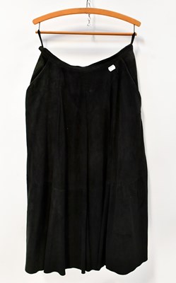 Lot 417 - A black suede A-line mid-length skirt, a Beged-...